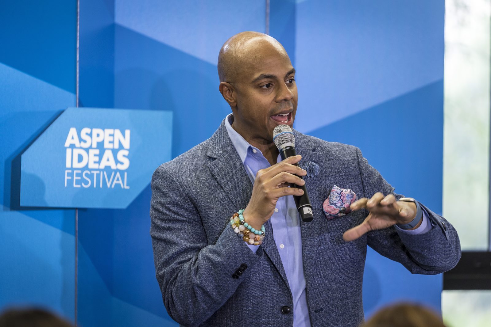 Scott speaking to a conference audience