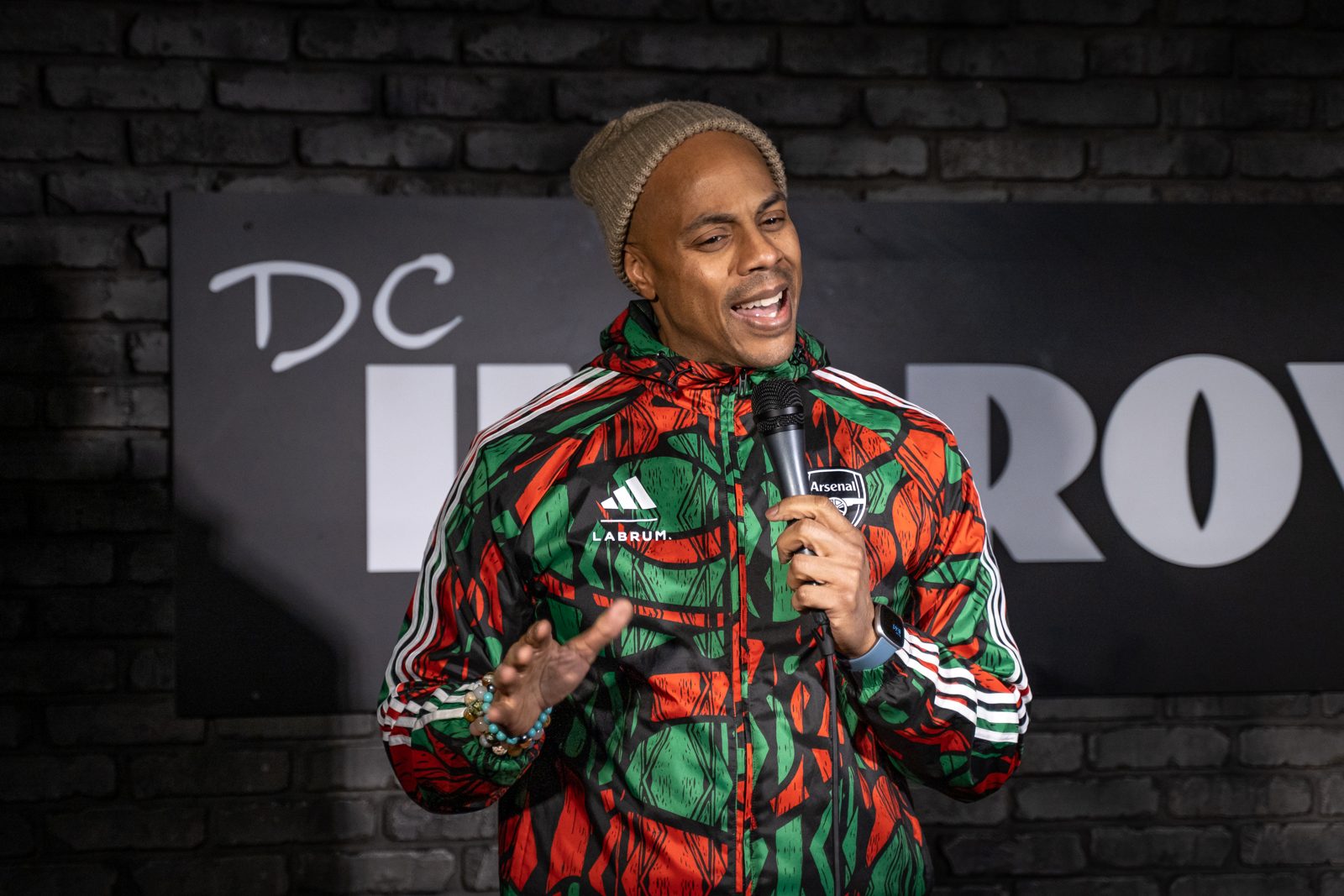 Scott performing on stage at DC Improv