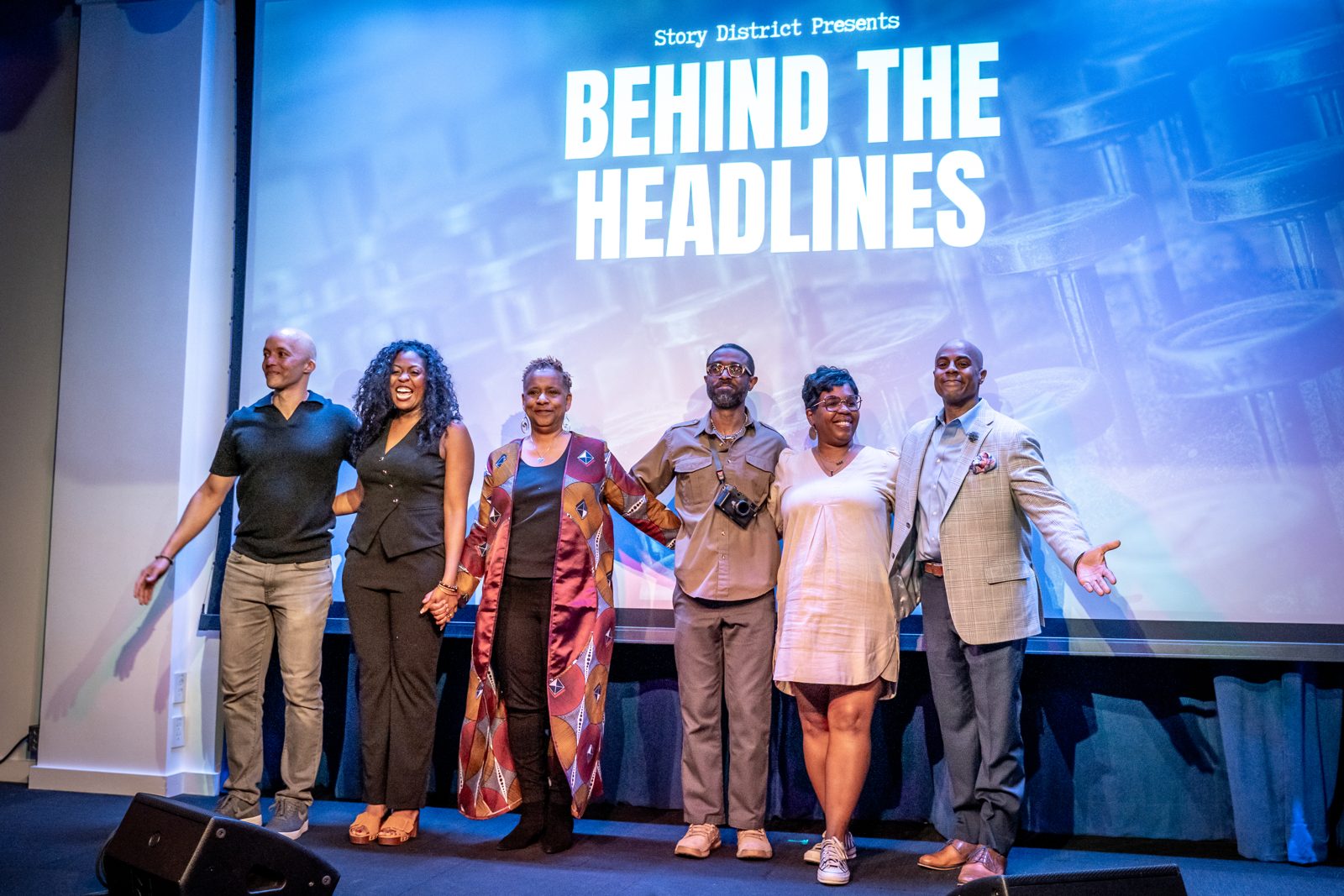 Five journalists on stage at Behind the Headlines